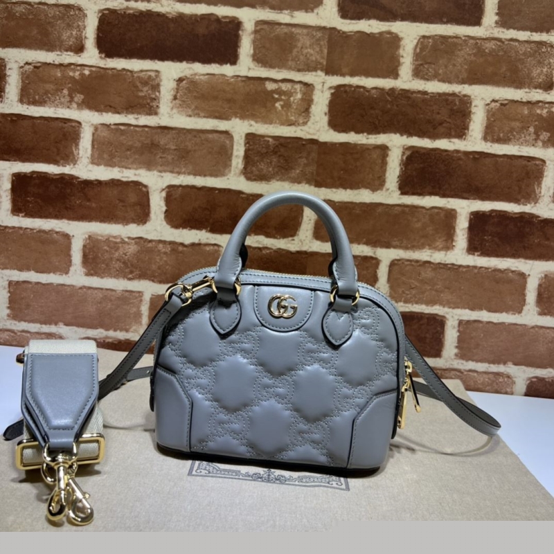 G*u*i top handle bags